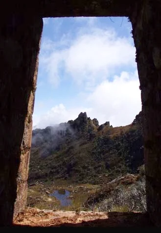 The doorway at Inca Wasi is a viewing platfom overlooking a huaca, located on an important national ceke line.