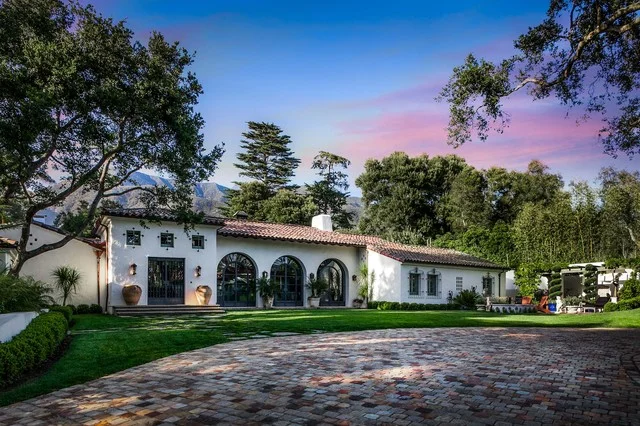 White Stucco with red roof top tiles and arched doorways | Image: by houzz.com