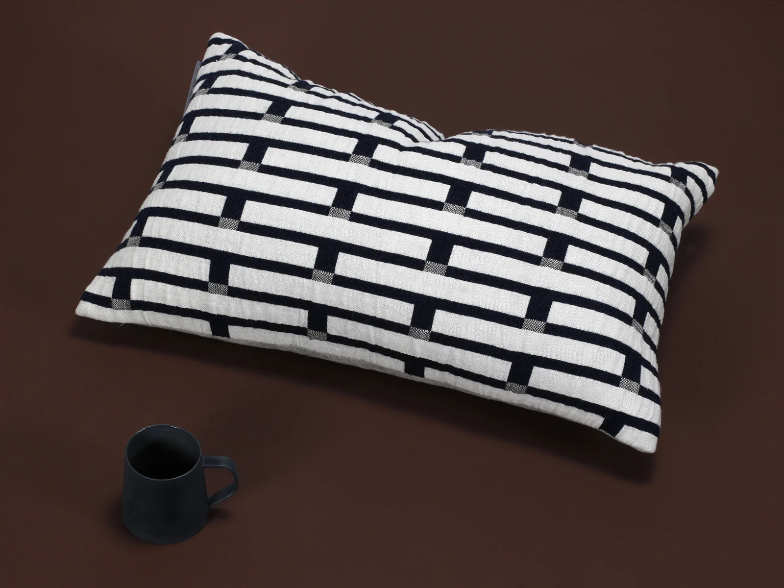 Eleanor_Pritchard_Broadchalke_chalk_cushion_with_mug_by_Elliott_Ceramics.jpg