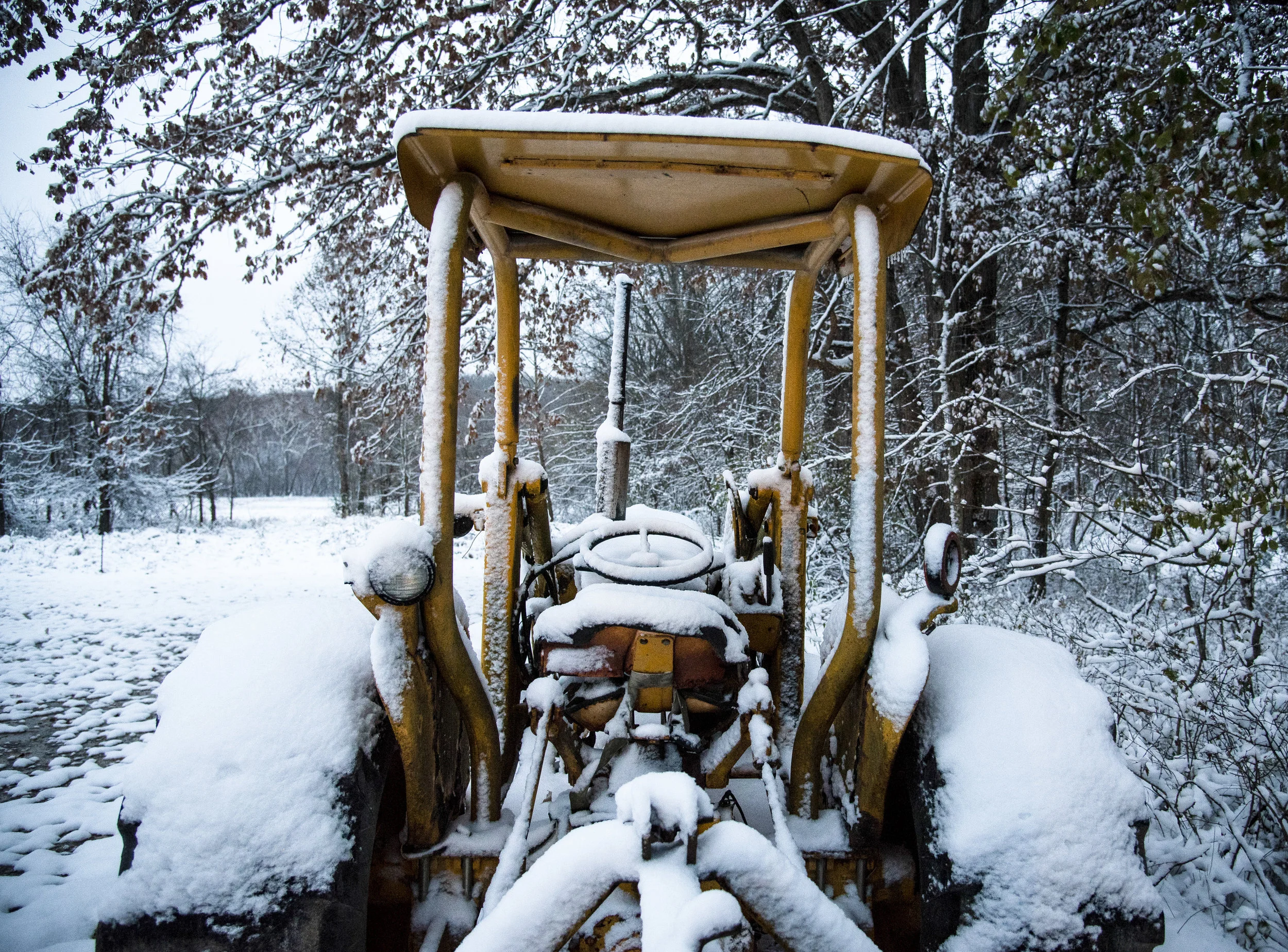 Yellow Tractor in Snow