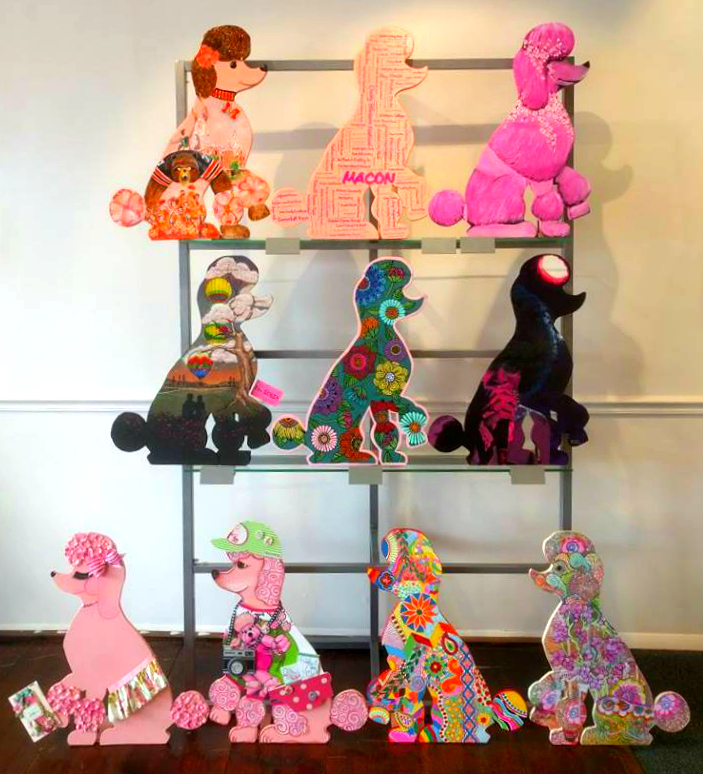 Painted poodles in the "Pink Poodle Parade" exhibit at The 567 Center.