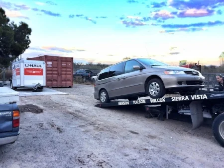 Big Dave's towing in Benson, AZ. Note the beautiful Arizona sky, as well as Junior's (one of the tow truck drivers), brilliant photo bomb. Can you find him?