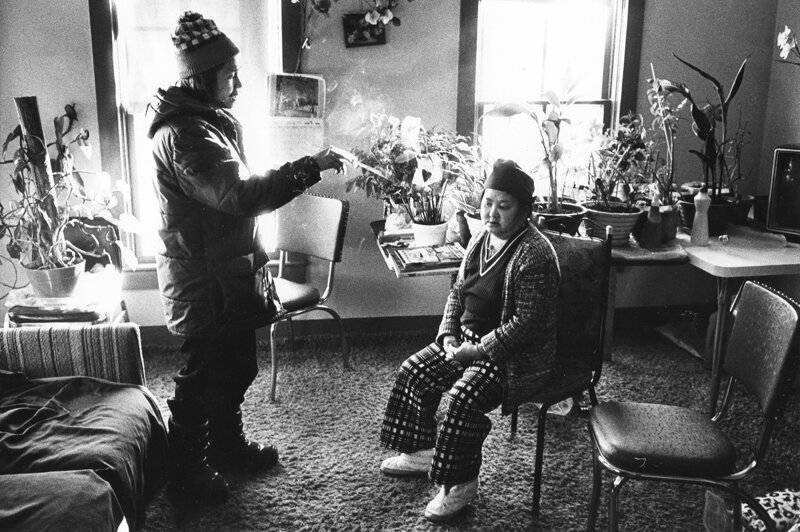 Joua Yang with incense stick attempting to heal Song Xiong.  Oshkosh, WI  1985