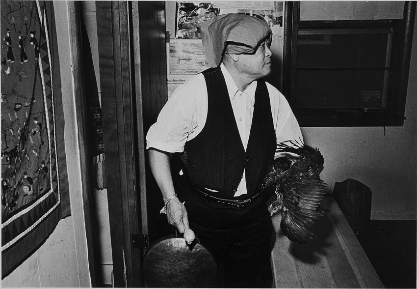 Nyia Houa Xiong with sacrificial chicken. Oshkosh, WI 1988