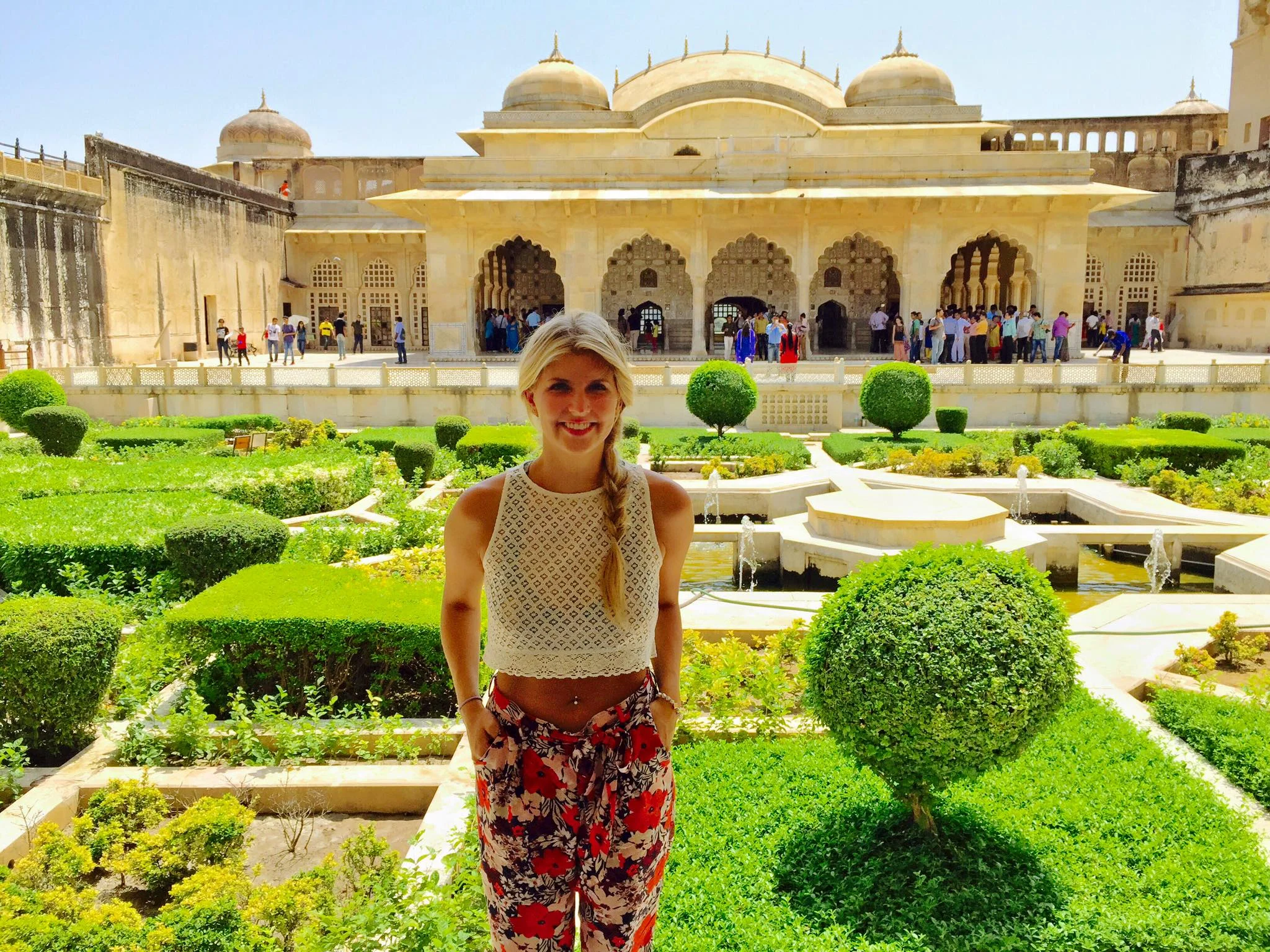 Ali ba ba pants and a crop top while sightseeing during the day at the City Palace
