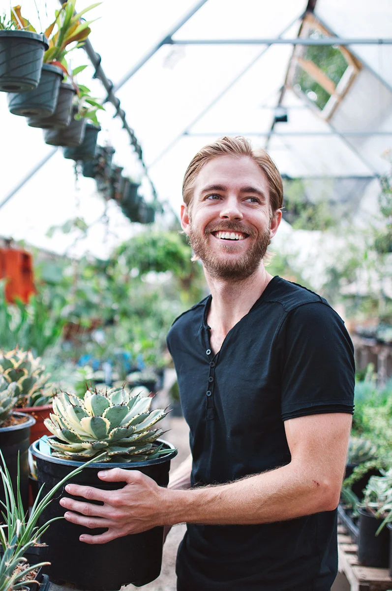 Corey lived in Hawaii for six years, and volunteered at the Lyon Arboretum, which is the only arboretum in a rainforest in the U.S. He hasn’t had a car in ten years. He likes being a minimalist and doesn’t want to drive in Austin traffic. His photo was taken at East Austin Succulents. “The train bypasses all the traffic. It’s a known quantity. It’s a 13 minute trip no matter what, which is really nice as opposed to 30 or an hour. I like the ability to do stuff on the train or bus, like read or work online or do something productive as opposed to just sitting behind a wheel.”