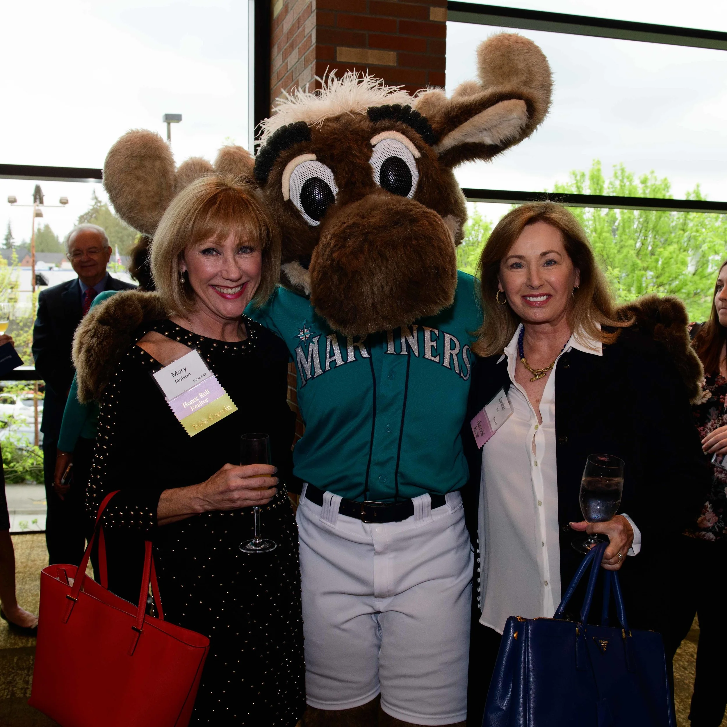 RSIR Broker Mary Nelson (left) and I were ecstatic to meet the Mariner Moose at the event!