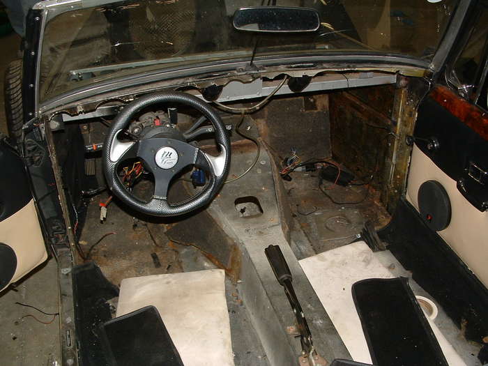 This shows the inside of the car you can see the old shifter hole this will be welded up and a new one made a few inches back