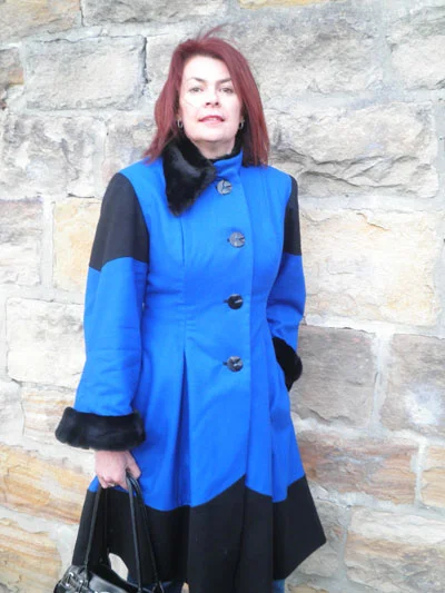 A bright blue and black coat, which includes gorgeous vintage buttons!