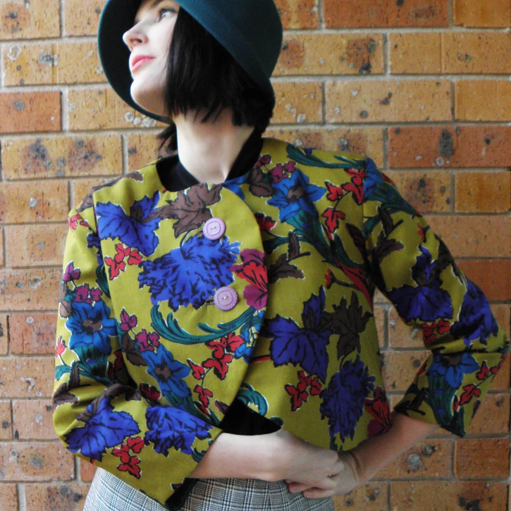 The Liberty Flowers Bolero was handmade from a Liberty of London wool print. I only ever made three copies of this design. It features beautiful vintage buttons, cute little welt button holes and silk lining.