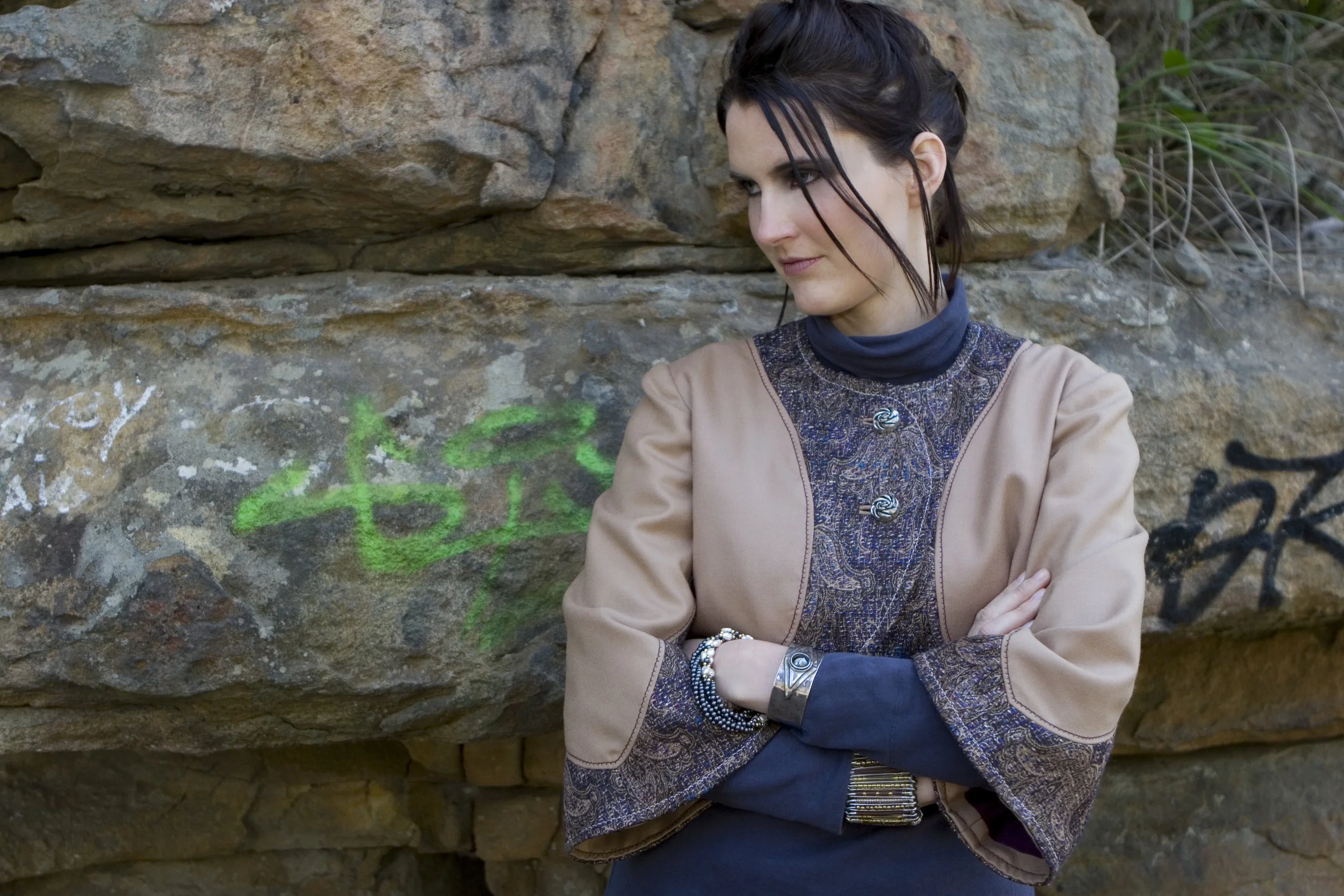 This is a one of a kind bolero I created. It uses a unique boucle for the contrast, and very pretty silver vintage buttons.