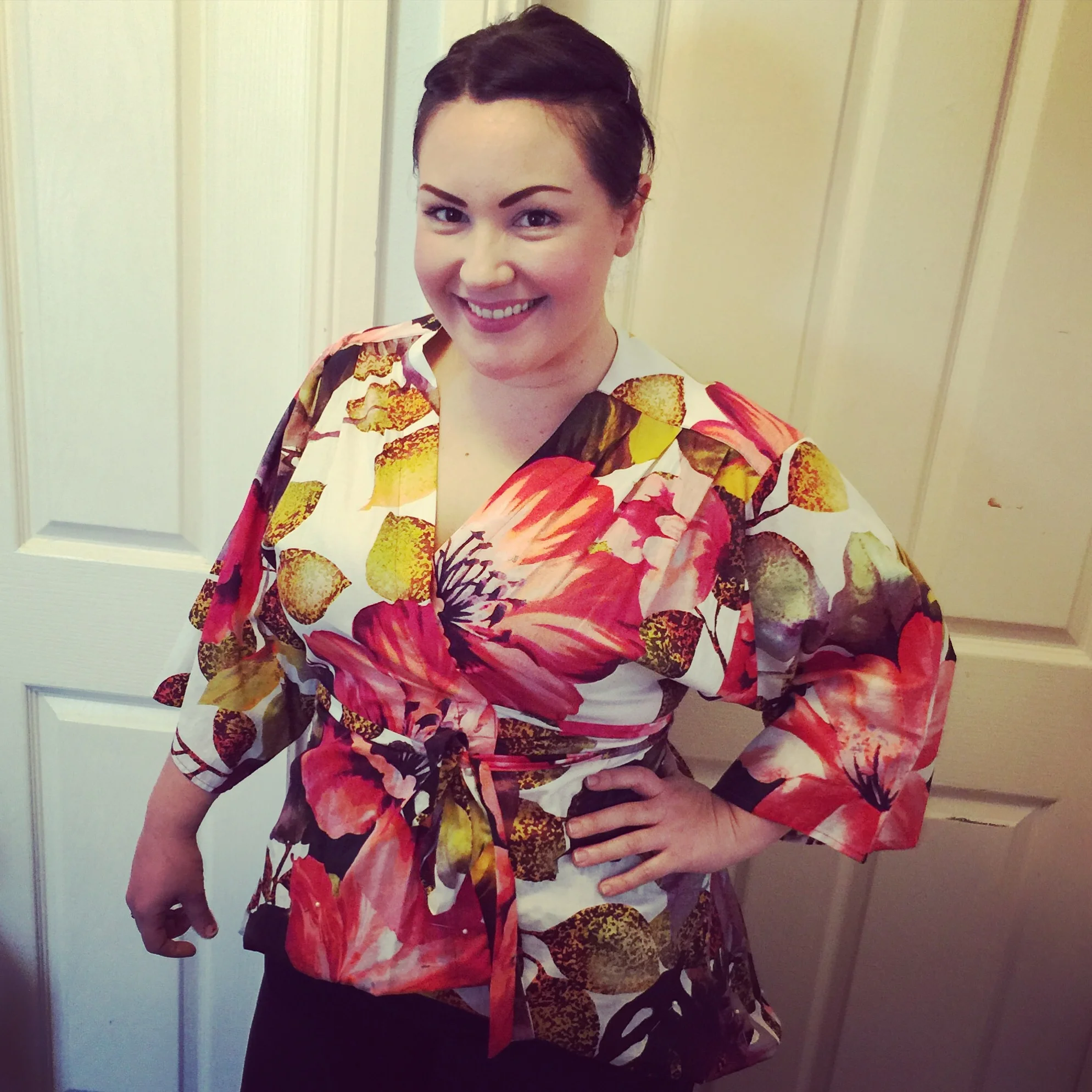 Candice is wearing the Hibiscus Kimono, a one of a kind design. 