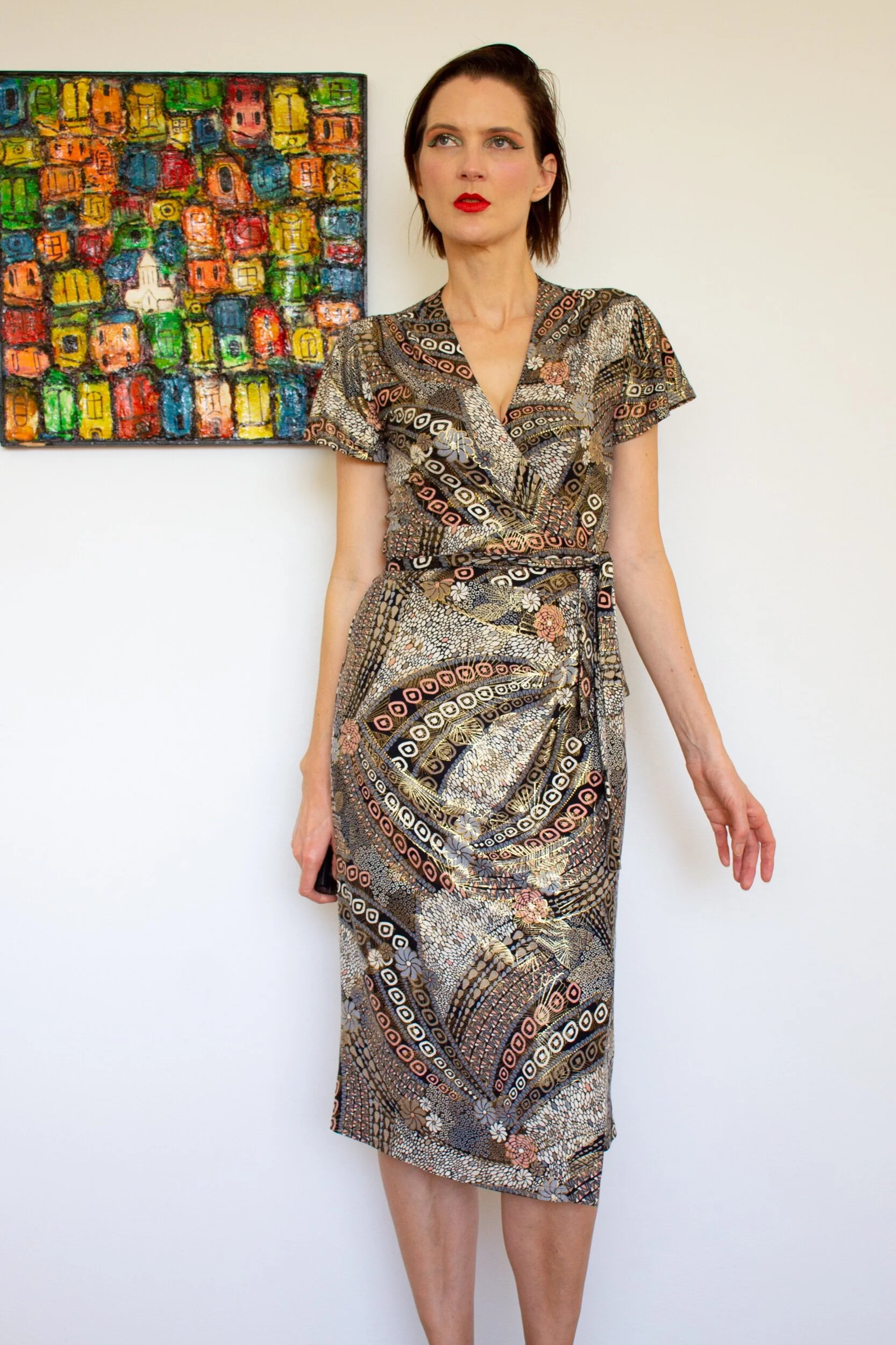 This dress style has a dramatic plunging V-neckline, and a long waist tie that makes this design adjustable. (Copy)