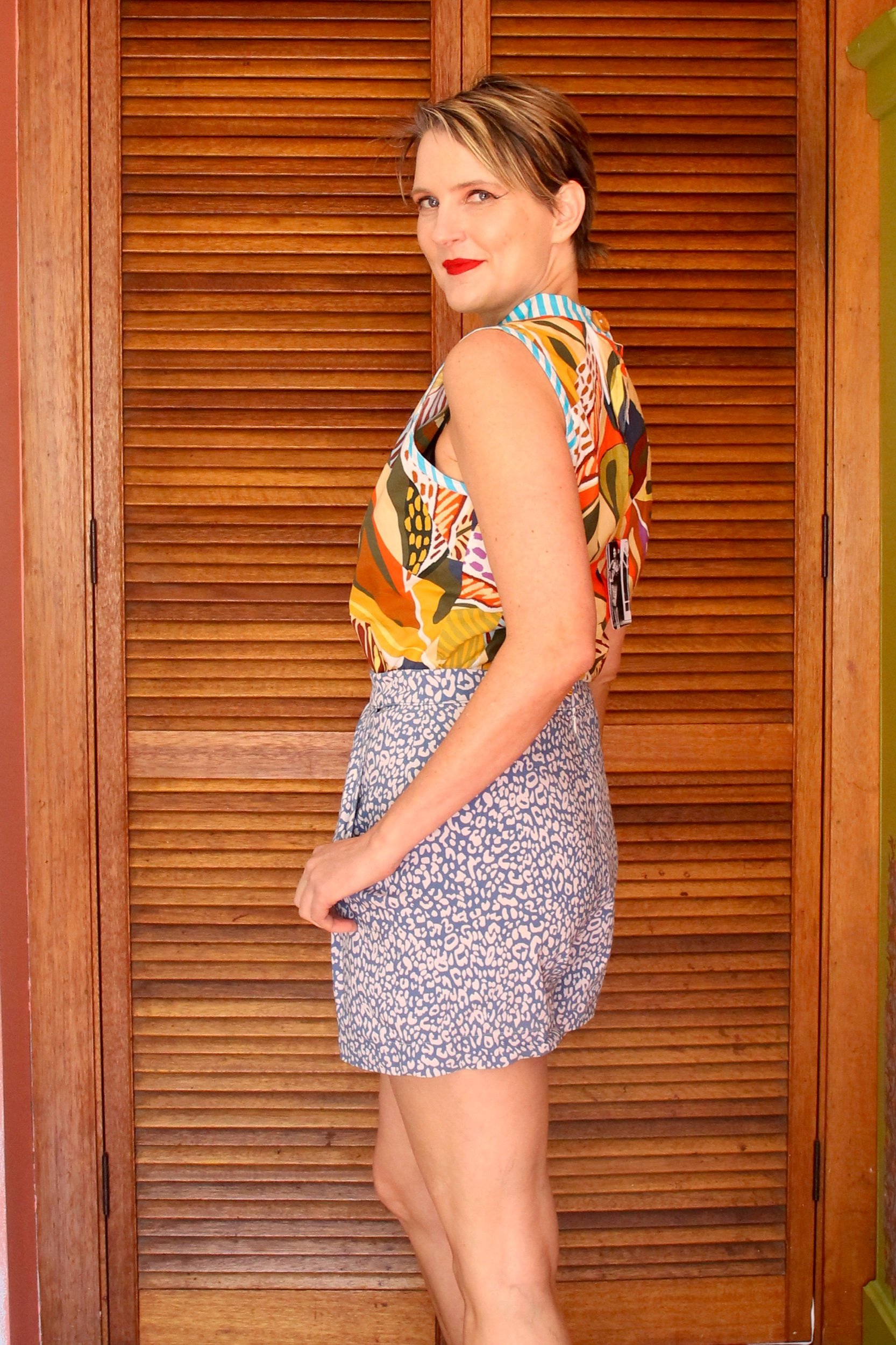 A handmade, bright coloured, sleeveless cotton blouse. Made in Sydney Australia by Penelope RED