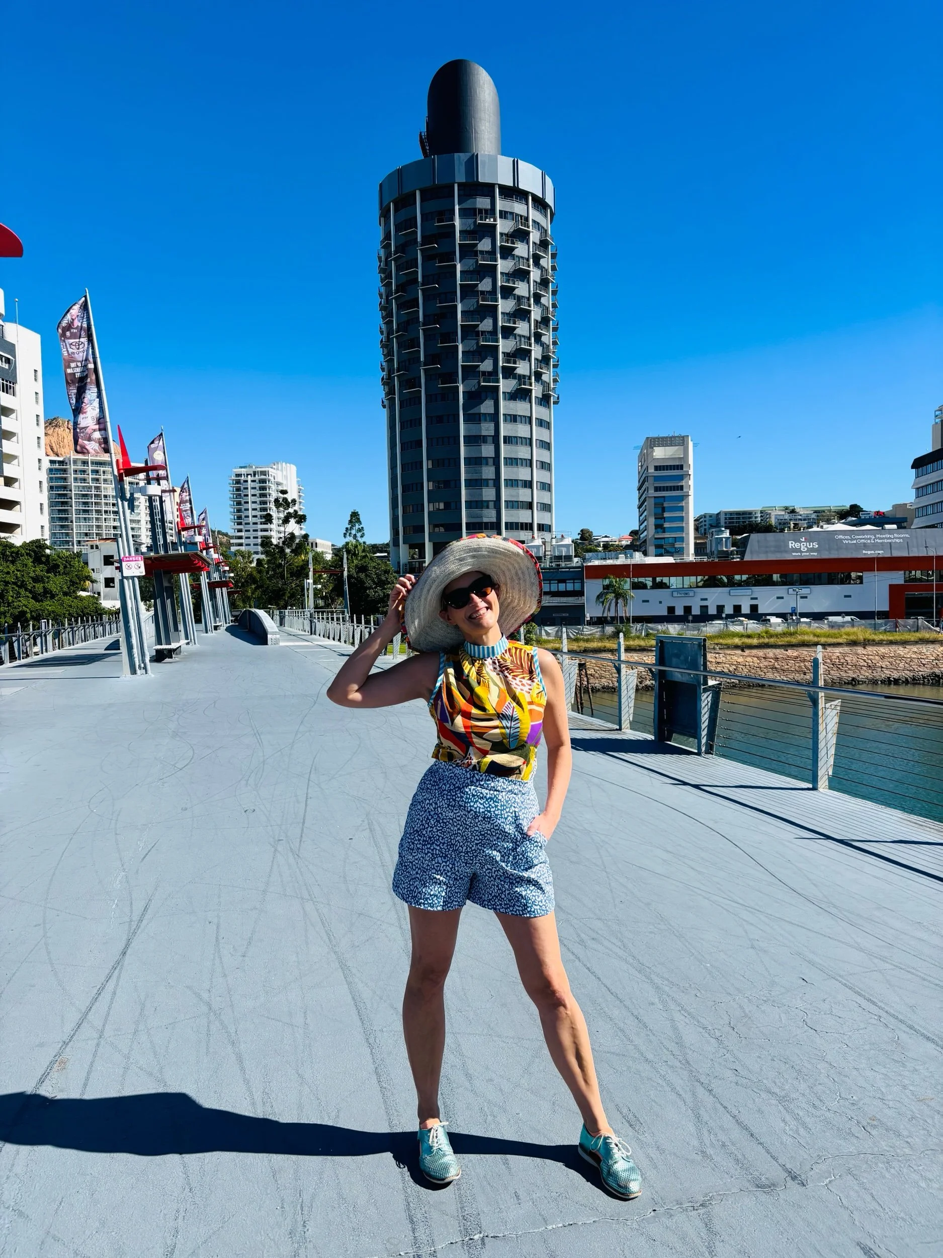 A handmade, bright coloured, sleeveless cotton blouse. Made in Sydney Australia by Penelope RED