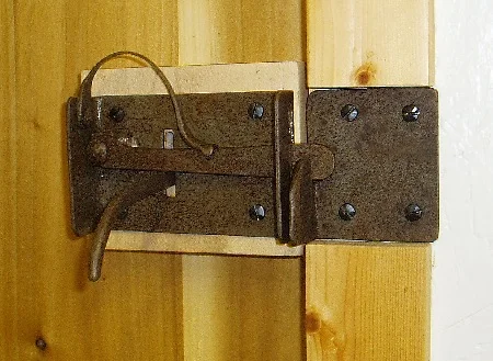 Yellow Poplar Door Spring assist door latch (rear). The spring assist makes the door closure much more positive and secure (compared to the conventional gravity catch). 