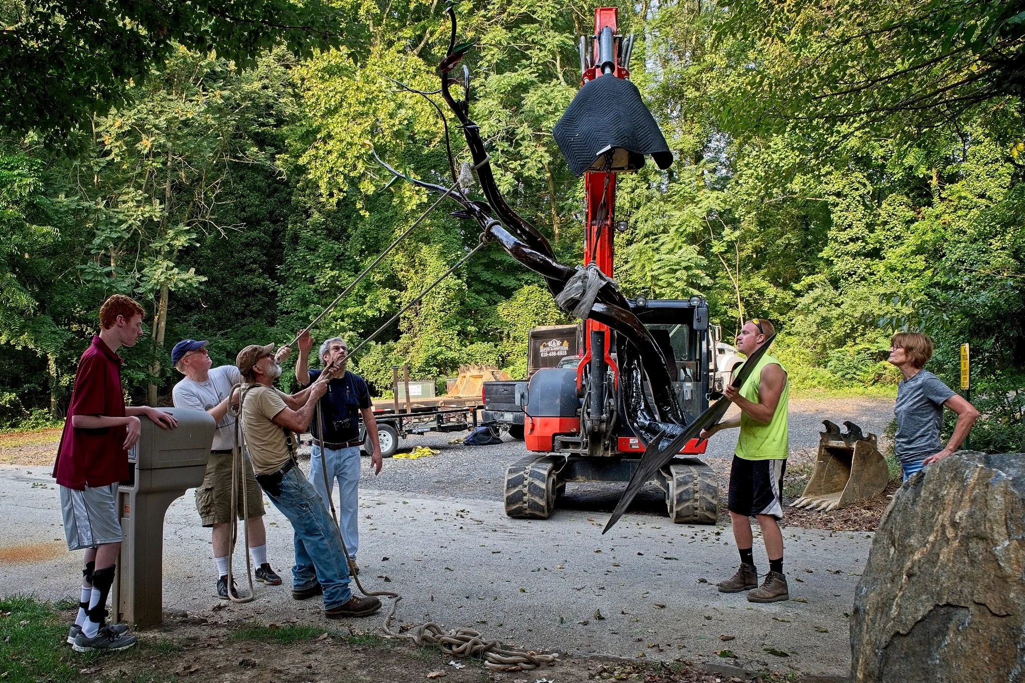 The work is carefully moved into place.
