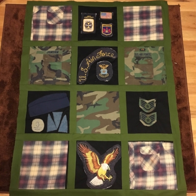 My most complicated quilt this week-- a memory quilt made of a bomber jacket, BDUs, a flannel shirt, and a few hats. 