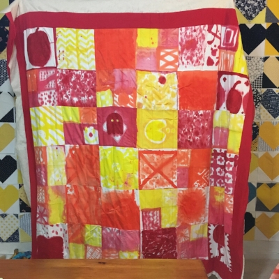 It's not trimmed or bound yet, but you can see it turned out pretty good. I used basic, (mostly) straight line quilting.