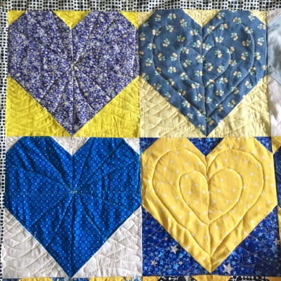 I couldn't resist starting to practice a little on the #OperationSmiley Quilts. I keep reminding myself what Angela says: "Practice makes progress." Only through spending time machine quilting will my lines become smoother and more accurate. 