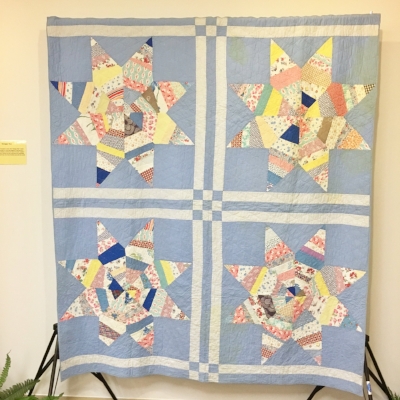 These scrappy stars are made with 1930s fabric but the quilting suggests the quilt may have been completed years after the top was pieced