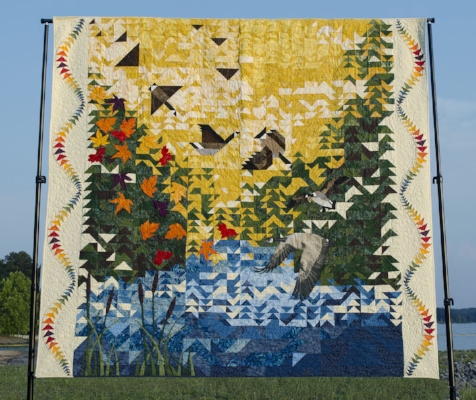 The 2017 Raffle Quilt, "Coming Home," that was made by more than 40 guild members