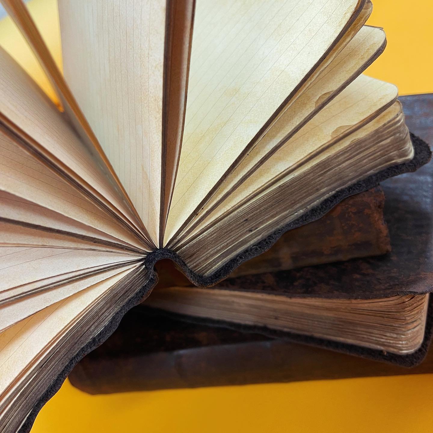 Did you know that we also make prop books for movies and TV? Some of our work has appeared on the big and small screen, so keep your eyes peeled for books tucked away in corners of scenes!

This set of leather notebooks are brand new but were aged to
