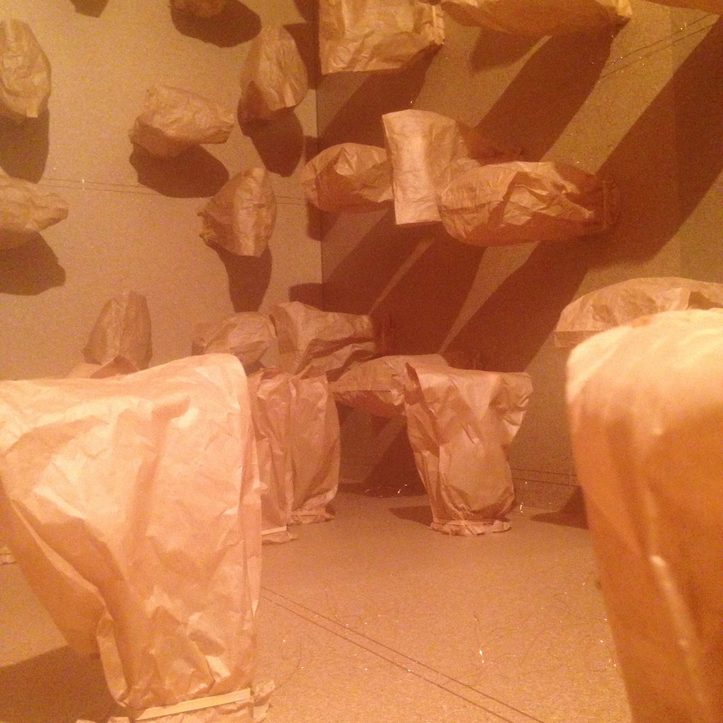 Zimoun, 317 prepared dc-motors, paper bags, shipping container, 2016