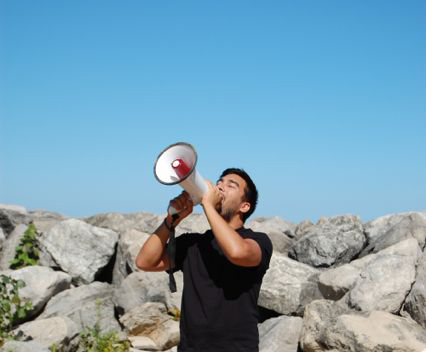 Alejandro T. Acierto, still of performance from 'Water Music on the Beach', Vocal performance with megaphone. curated by Tricia Van Eck, 7 September 2014