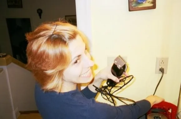Samantha getting ready to shave her head during treatment in 2005