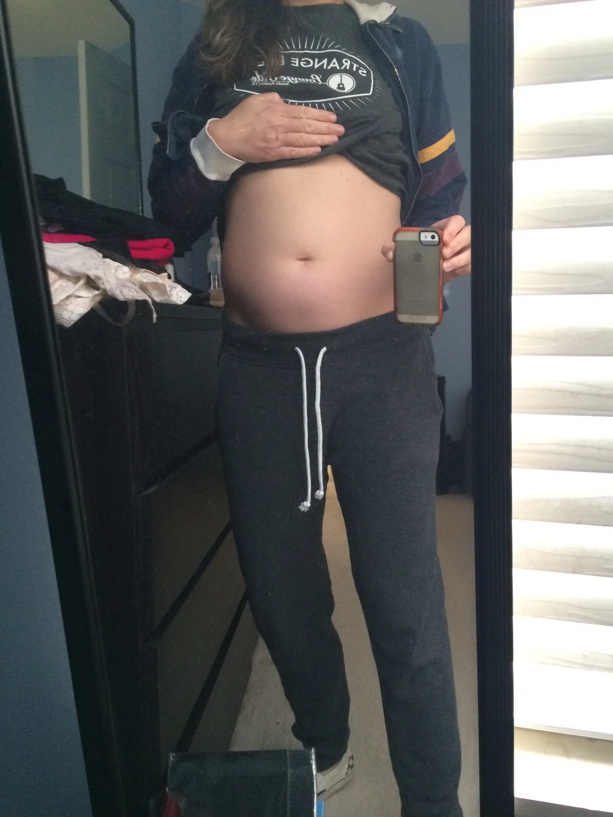 This is what a bloated abdomen from ovarian cancer looks like- this photo was taken the night before my diagnosis and surgery in which my gyn-onc removed a tumor the size of a grapefruit and a tumor the size of a volleyball. I looked pregnant.