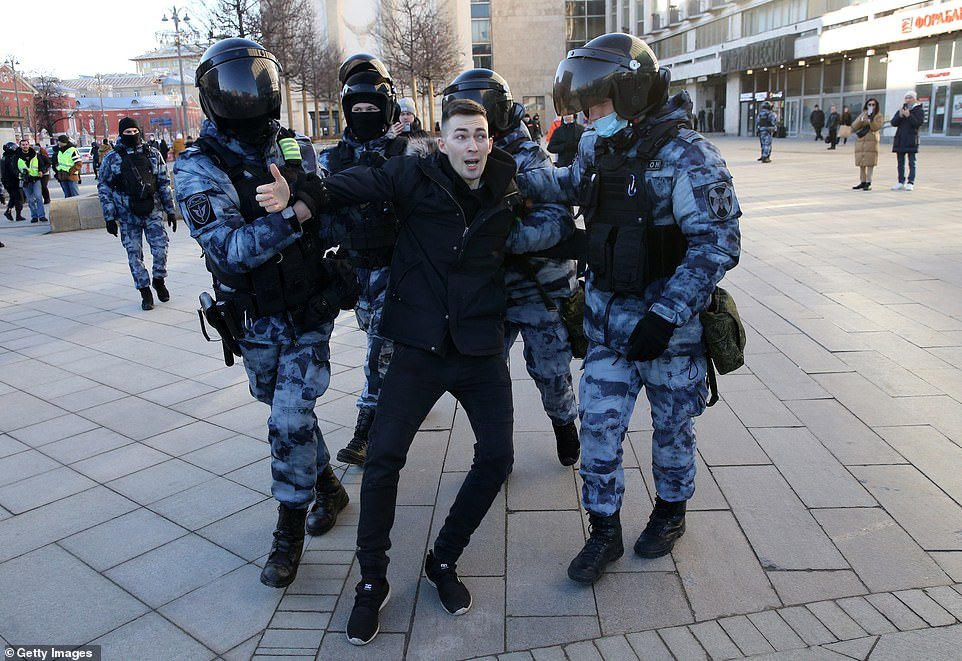  Original caption: A protester is dragged away by Omon paramilitary members during a demonstration in Moscow on Sunday. [ Article. ]  Getty Images  