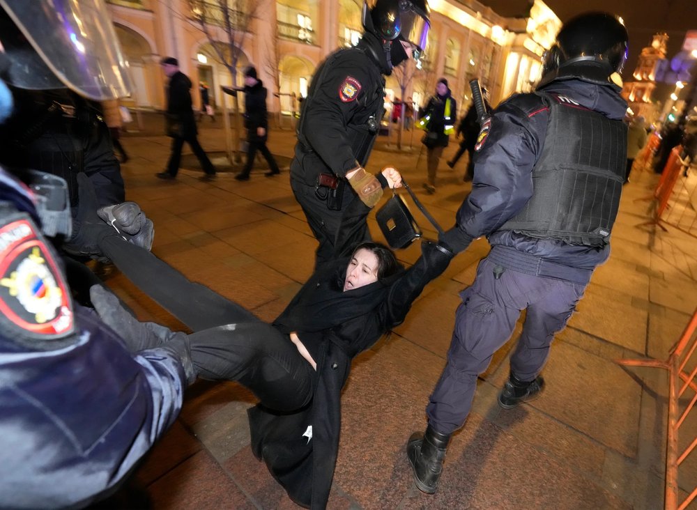  Police detain a demonstrator during an action against Russia's attack on Ukraine in St. Petersburg, Russia, Wednesday, March 2, 2022. Protests against the Russian invasion of Ukraine resumed on Wednesday, with people taking to the streets of Moscow 