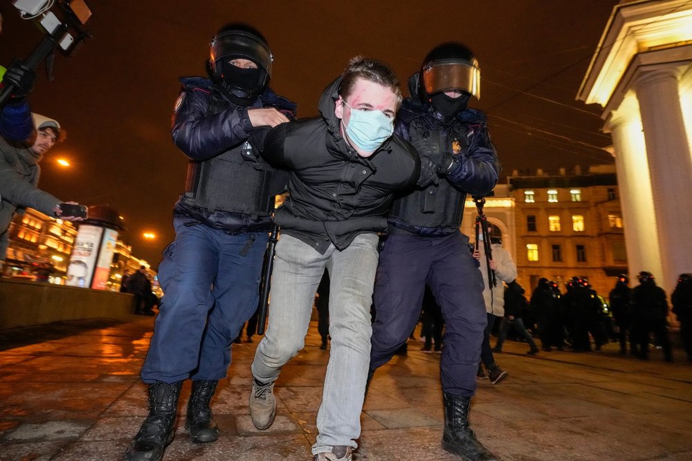 Police detain a demonstrator during an action against Russia's attack on Ukraine in St. Petersburg, Russia, Wednesday, March 2, 2022. [ Article. ]  DMITRI LOVETSKY, AP  