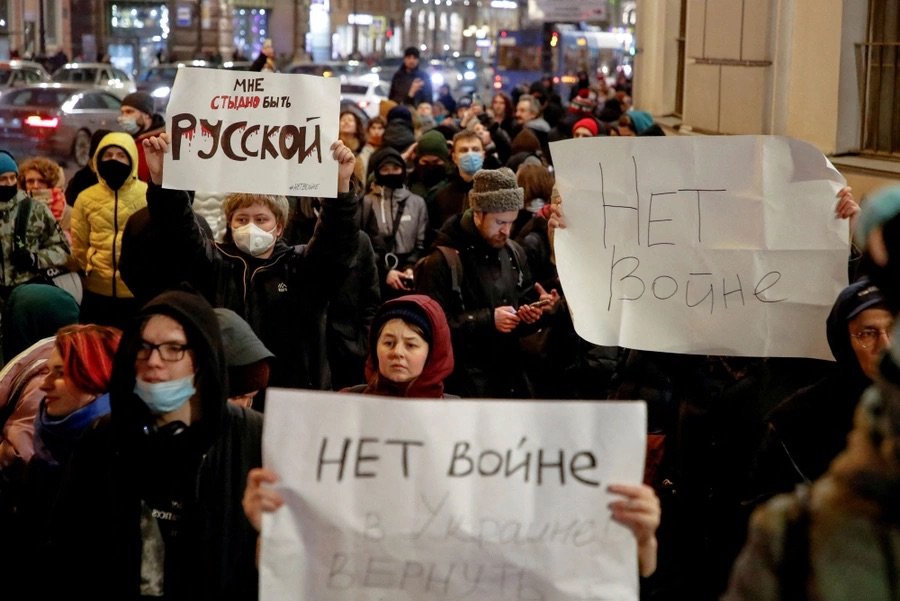  People attend an anti-war protest in St. Petersburg on February 24, 2022. The banners read: "I'm ashamed to be Russian" and "No war." [ Article. ]  Anton Vaganov/Reuters  