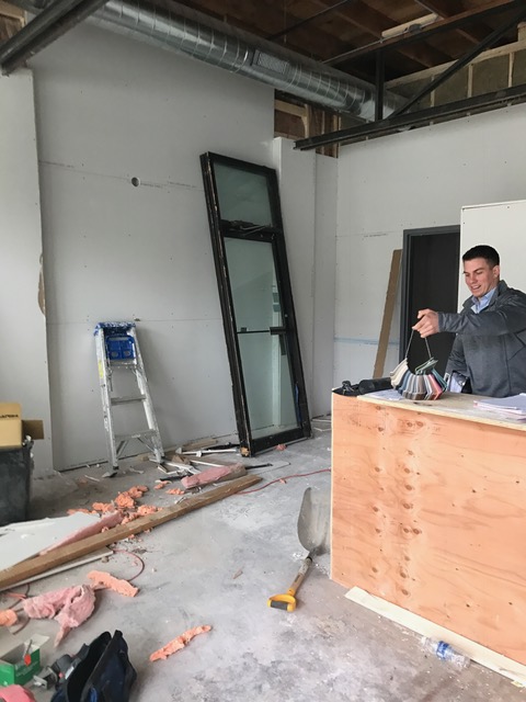 My project manager was helping to choose some floor board colors this morning during our weekly meeting. (note the second, unused door, in the background)