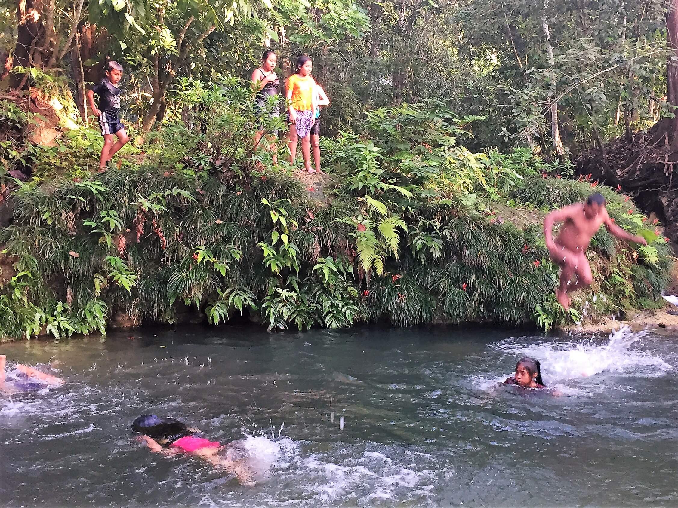 Kekchi kids enjoy swimming in their favorite swimming hole.