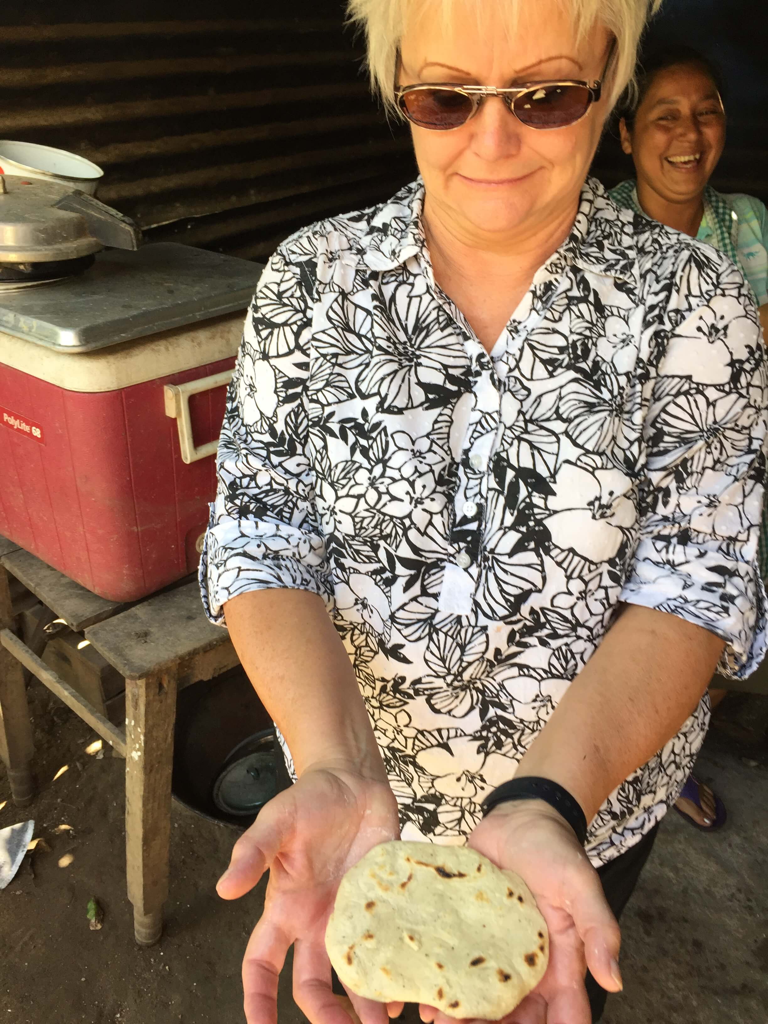 Carla is proud of her tortilla she made! 