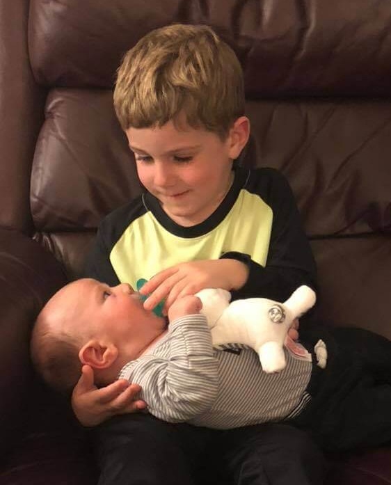 Brayden does his big brother routine with Landon.