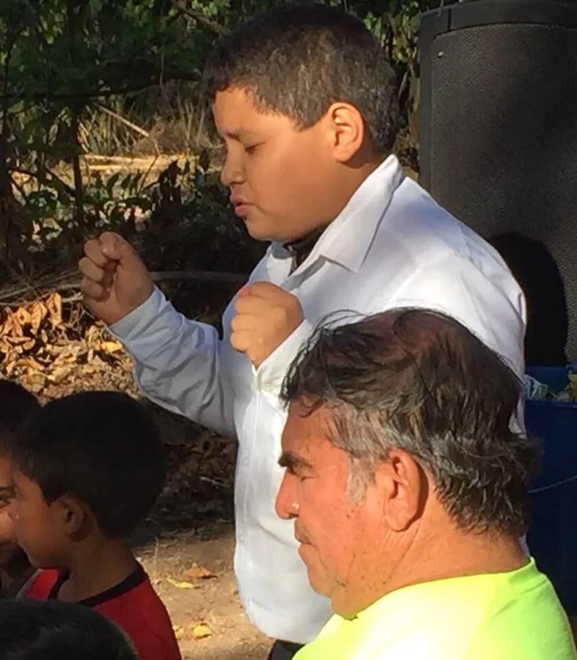 Sanders, a 12 year old boy, prays at the end of our meeting in Las Bolsitas. Called “the preacher,” Sanders has been a believer for a couple of years and owes his dedication to God delivering him his life when he had no hope for living through a serious illness.