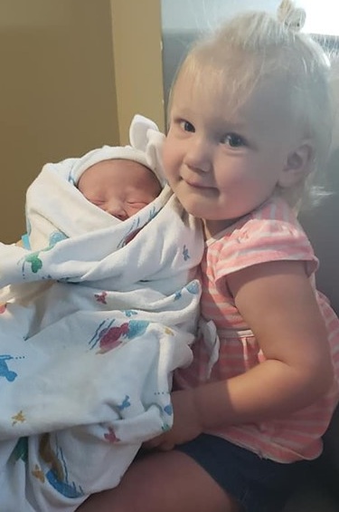 Our grand-daughter, Bridget, holds Adalyn, her new baby sister! Bobbi and Ryan Reed are the proud parents. All are doing well!