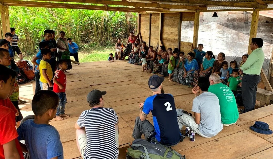 After about an hour and a half hike, we got to the village and learned that in March, four families came together to start a church there. However, a couple of people in the community vowed to burn their houses down if they proceeded to start the church. Read the rest of the story below. Here, German makes introductions and shares what we would like to do together with them. Note that they have worked on building their meeting space out of lumber they cut from the jungle with chain saws.