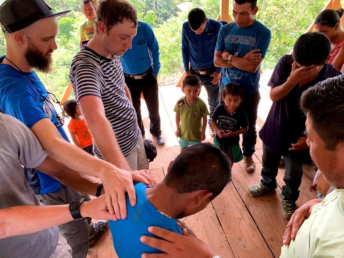 After sharing faith stories, this young man asked if someone would help him become a follower of Jesus like the others in this new church. Here, German is leading him in a prayer of salvation as we prayed together with him.