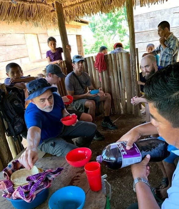 After playing soccer in Raxaha, the church ladies fixed us a meal of beans and eggs and tortillas. With no utensils, the custom is to use the tortillas to scoop the food into your mouth. Here Todd is getting another tortilla to help in his efforts!