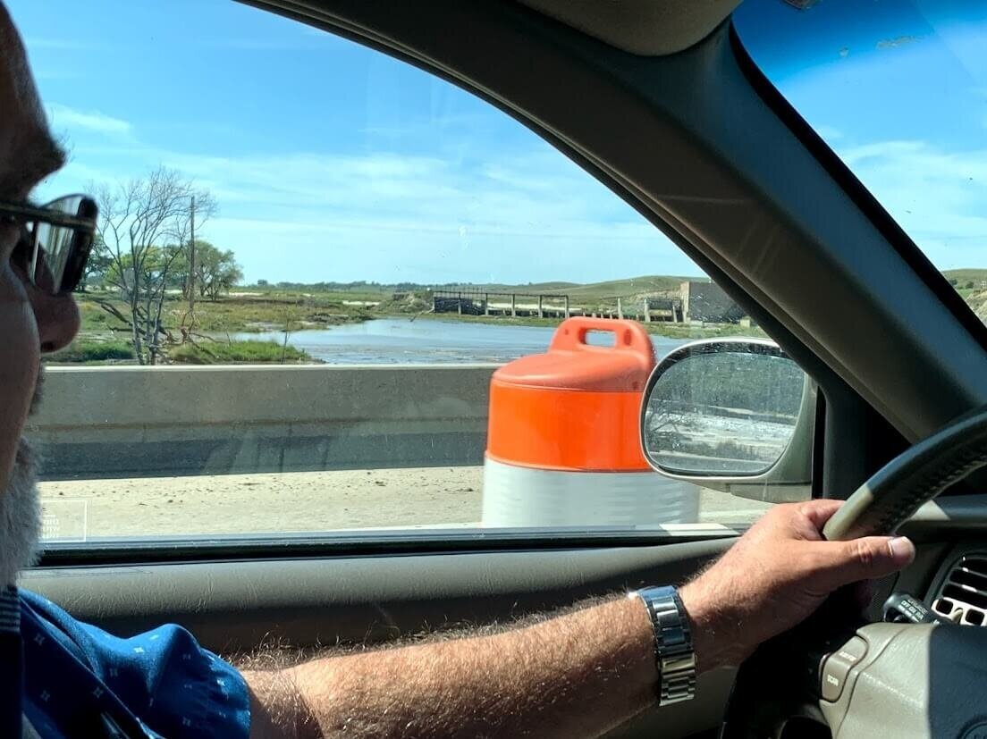 On the Niobrara river near Lynch, Nebraska, Joel Wentworth surveys the remnants of the dam that got washed out in the March flood.