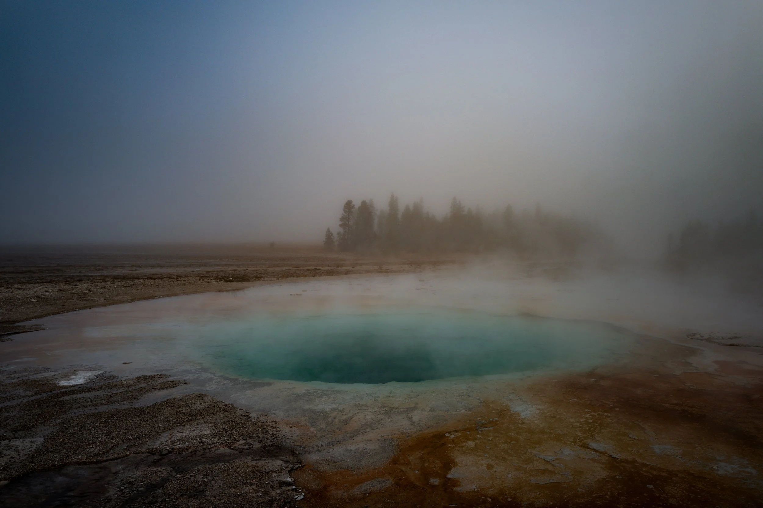  Chasing the rising sun and the steam clouds across Yellowstone's powerful, seismic heart. The light here moves differently, almost as a character itself, carving mountains and catching the steam plumes that rise from the earth's core.    SHOP THIS S