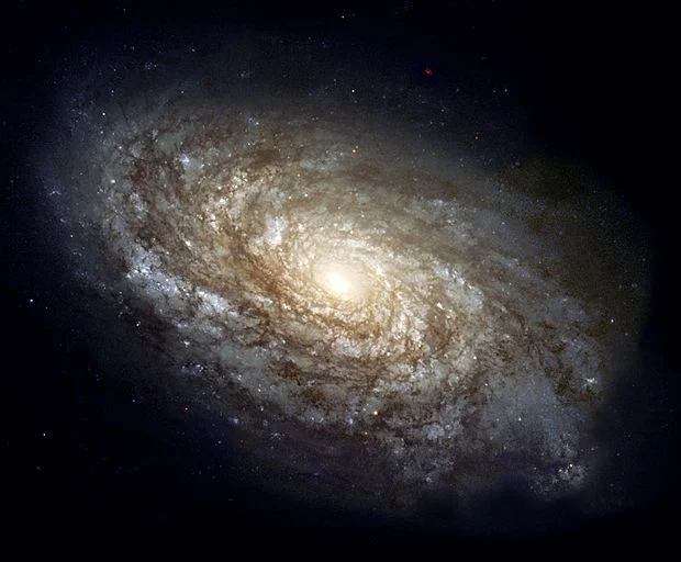 NGC 4414 , a typical spiral galaxy in the constellation Coma Berenices , is about 55,000 light-years in diameter and approximately 60 million light-years away from Earth