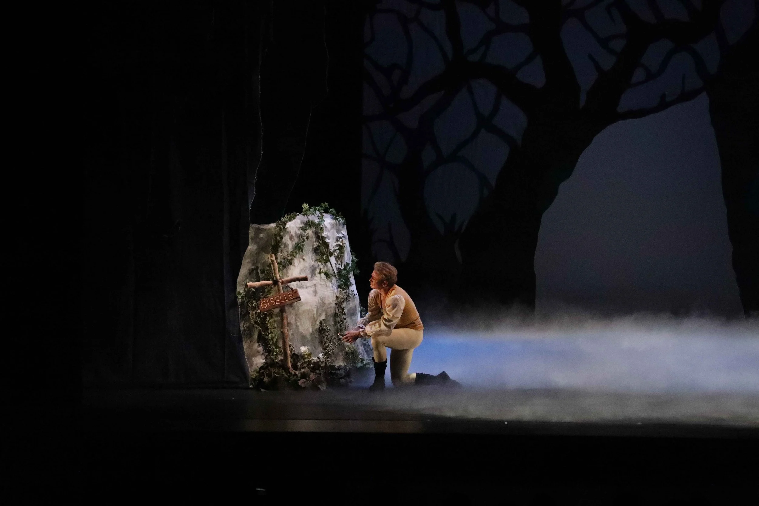  In Act 2, the curtain opens on Hilarian making a cross for Giselle’s grave. 