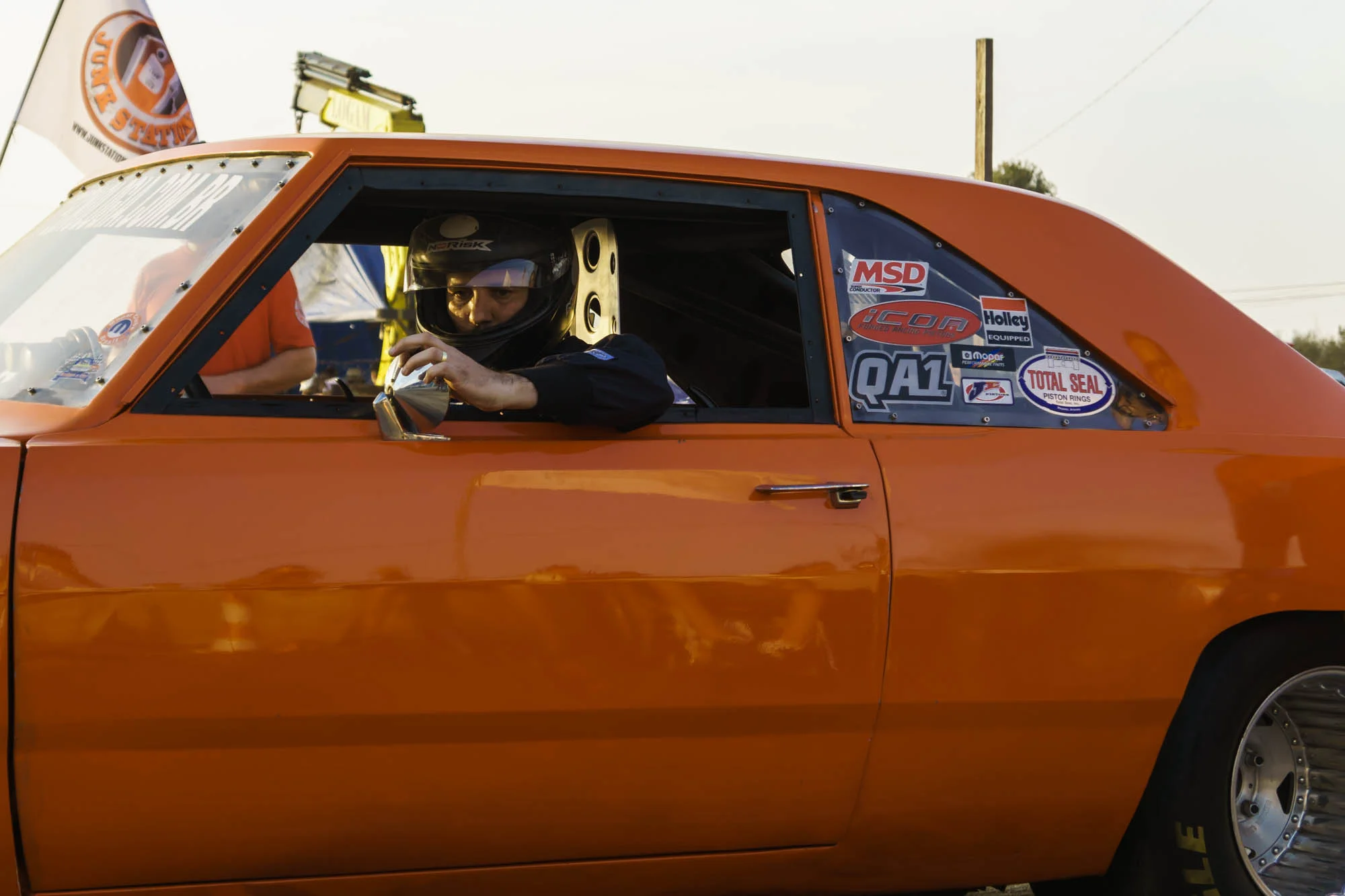 Man in Helmet adjusts Rear Mirror