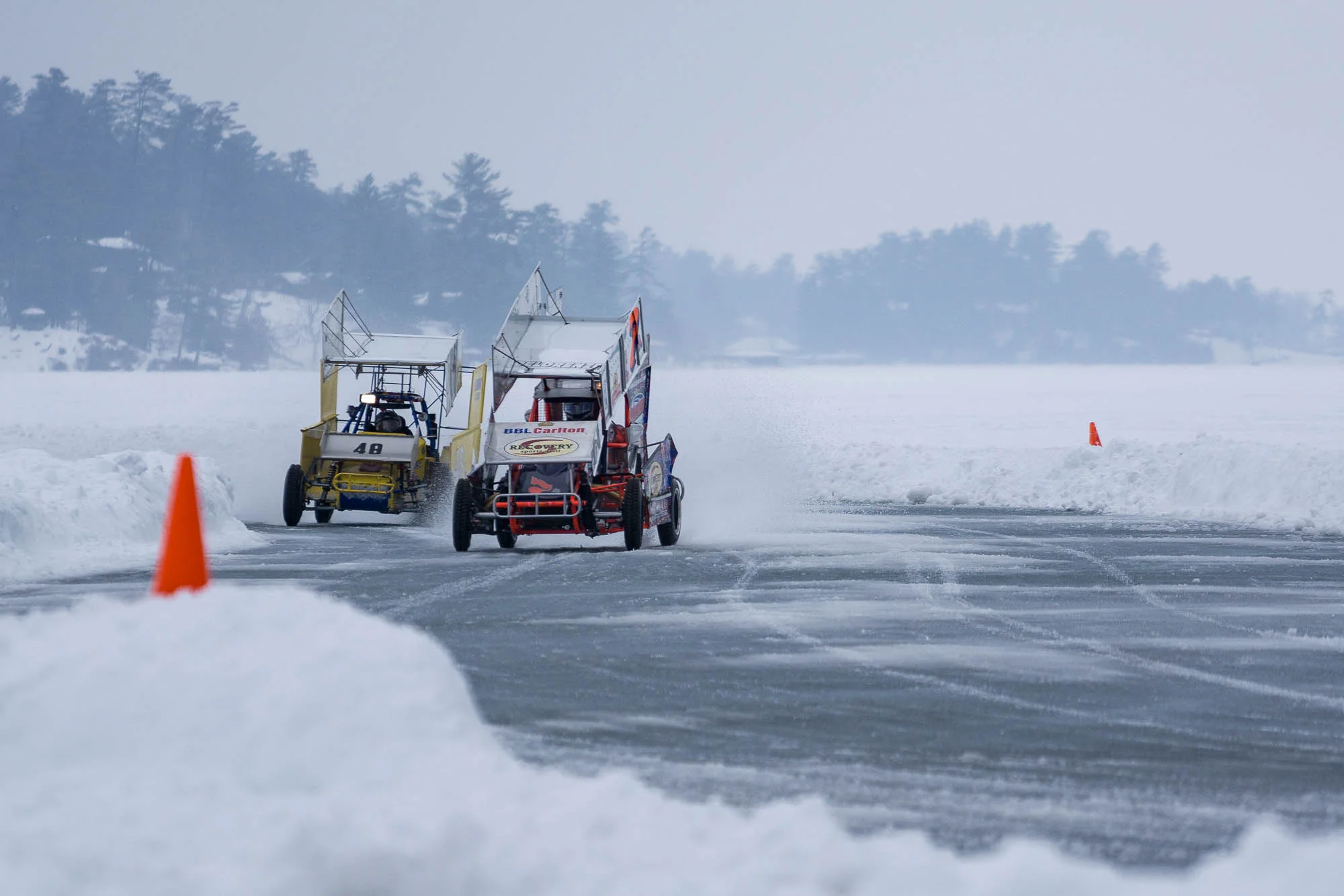 Modifieds streaking through a turn